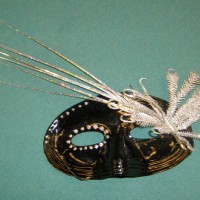 Silver butterfly & bling on black domino mask. Staples & glue $25
